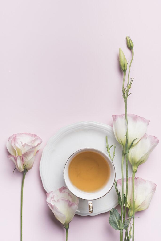 close-up-beautiful-eustoma-flowers-with-cup-tea-against-pink-background-684x1024 Mastering the Art of Applying White Tea on Your Face