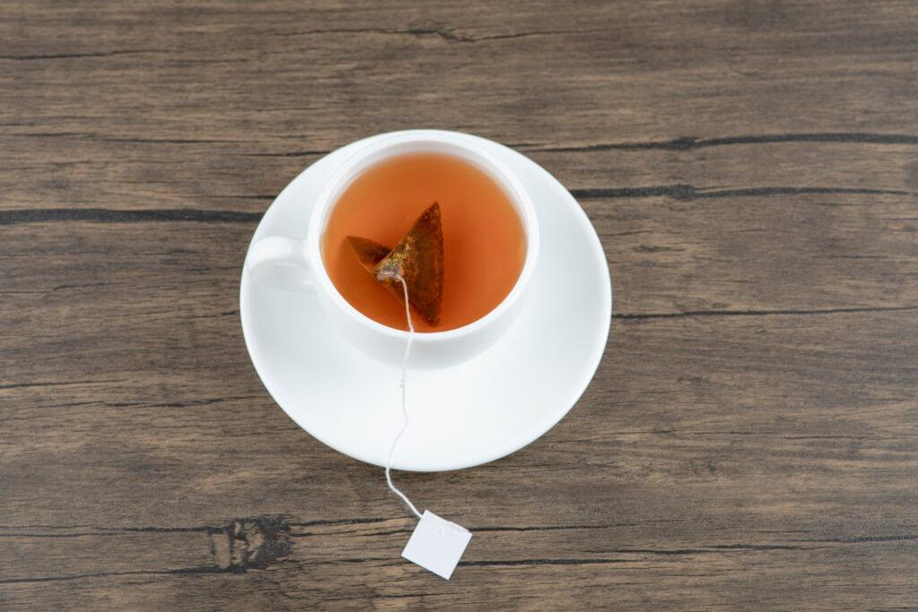 white-cup-tasty-hot-tea-with-teabag-wooden-table-1024x683 Unveiling the Art of Tea Bag Compresses